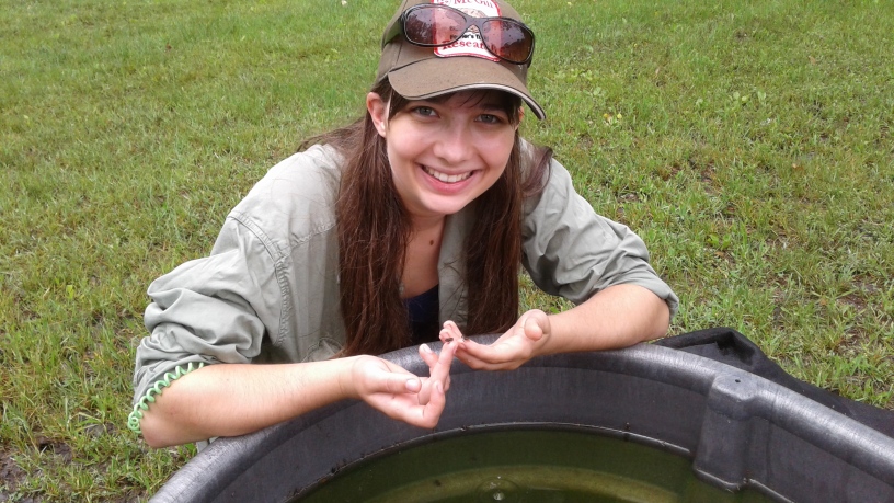 Jessica Ford with toadlets. Photo provided by Jessica Ford